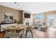 Open living area with hardwood floors, a fireplace, a balcony, and modern decor at 9079 E Panorama Cir # 520, Englewood, CO 80112