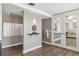 A common area with mailboxes and entryway with wood flooring, and modern lighting fixtures at 9079 E Panorama Cir # 520, Englewood, CO 80112