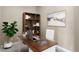 Modern office setup with sleek desk, stylish bookshelf, and a calm aesthetic at 9079 E Panorama Cir # 520, Englewood, CO 80112