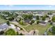 Picturesque aerial view of a neighborhood featuring well-maintained homes, lush trees, and spacious yards at 8007 Sunrise Cir, Frederick, CO 80516