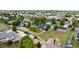 Spacious residential property with a large yard, surrounded by mature trees and a white fence at 8007 Sunrise Cir, Frederick, CO 80516