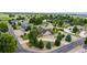 Beautiful aerial view of a residential property nestled among mature trees and well-maintained landscaping at 8007 Sunrise Cir, Frederick, CO 80516