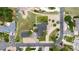 An aerial view of a well-maintained home, with a manicured yard, detached garage, and access to community roads at 8007 Sunrise Cir, Frederick, CO 80516