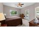 Neutral primary bedroom with a comfortable bed, dresser, and natural light at 8007 Sunrise Cir, Frederick, CO 80516