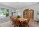 Cozy dining room featuring a large window, table with seating for eight, and neutral colors at 8007 Sunrise Cir, Frederick, CO 80516