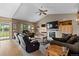 Cozy living room with vaulted ceilings, fireplace, and comfortable seating arrangement at 8007 Sunrise Cir, Frederick, CO 80516