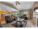Inviting living room with a cozy fireplace, hardwood floors, and ample natural light at 8007 Sunrise Cir, Frederick, CO 80516