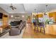 Comfortable living room featuring hardwood floors, breakfast bar, and two sofas for relaxation at 8007 Sunrise Cir, Frederick, CO 80516