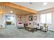 Basement living room featuring a wood plank ceiling, comfortable seating, and a cozy atmosphere at 10773 Cougar Rdg, Lone Tree, CO 80124