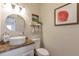 Bright bathroom with modern vessel sink, granite counters, white cabinets and decor at 10773 Cougar Rdg, Lone Tree, CO 80124