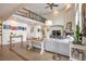 Bright and airy living room features a high ceiling, balcony view, fireplace, and stylish decor at 10773 Cougar Rdg, Lone Tree, CO 80124