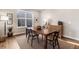 Well-lit dining area with a rustic wooden table and sideboard at 1845 Marlowe E Cir, Erie, CO 80516