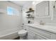 Bright bathroom with a tub, shower, and vanity, designed for comfort and convenience at 1632 Ulster St, Denver, CO 80220