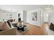 Cozy living space with hardwood floors, stylish decor, and connecting rooms at 1632 Ulster St, Denver, CO 80220