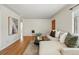 Bright living area with hardwood floors, soft decor, and a welcoming atmosphere at 1632 Ulster St, Denver, CO 80220