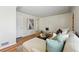 Comfortable living room with a large sofa, hardwood floors and light walls at 1632 Ulster St, Denver, CO 80220