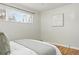 Airy bedroom with hardwood floors and a window, offering a clean and peaceful atmosphere at 1632 Ulster St, Denver, CO 80220