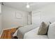 Inviting bedroom with hardwood floors, soft lighting, and closet space, ensuring relaxation and convenience at 1632 Ulster St, Denver, CO 80220