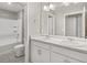 Bathroom featuring vanity, sink, mirror and a door that leads to another room at 17817 Dandy Brush Dr, Parker, CO 80134