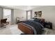 Stylish bedroom with modern decor, comfortable bed, and ample natural light at 17817 Dandy Brush Dr, Parker, CO 80134