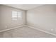 Carpeted bedroom with two windows at 17817 Dandy Brush Dr, Parker, CO 80134