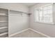 Walk-in closet featuring shelving, hanging rod, and window at 17817 Dandy Brush Dr, Parker, CO 80134