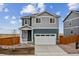 Charming two-story home with a two-car garage and landscaped front yard at 17817 Dandy Brush Dr, Parker, CO 80134
