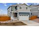 Inviting two-story home with a two-car garage, nice landscaping, and pleasant curb appeal at 17817 Dandy Brush Dr, Parker, CO 80134
