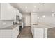 New kitchen features a granite island, stainless appliances, and wood flooring at 17817 Dandy Brush Dr, Parker, CO 80134