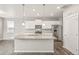 New kitchen features a granite island, stainless appliances, and wood flooring at 17817 Dandy Brush Dr, Parker, CO 80134