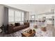 Bright and open living room featuring an open floor plan into the kitchen area at 17817 Dandy Brush Dr, Parker, CO 80134
