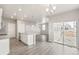 Bright open living space with wood floors, and sliding glass doors at 17817 Dandy Brush Dr, Parker, CO 80134