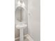 Powder room featuring pedestal sink and oval mirror at 17817 Dandy Brush Dr, Parker, CO 80134