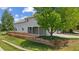 Beautiful backyard featuring a spacious wooden deck and mature landscaping on a sunny day at 10570 Echo Ct, Firestone, CO 80504