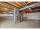 Unfinished basement space with concrete floor and exposed mechanical systems ready for personalization and development at 10570 Echo Ct, Firestone, CO 80504