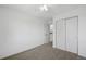 Bedroom features a ceiling fan and large closet with sliding doors at 10570 Echo Ct, Firestone, CO 80504