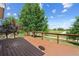 Large wood deck with views of the lush green lawn and golf course at 10570 Echo Ct, Firestone, CO 80504