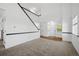 Spacious living room with neutral walls and carpeting and modern finishes throughout at 10570 Echo Ct, Firestone, CO 80504