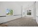Bright and airy living room with large windows, providing ample natural light and neighborhood views at 10570 Echo Ct, Firestone, CO 80504