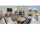 Cozy living room with fireplace, stylish decor, and sliding door access to outdoor deck at 10570 Echo Ct, Firestone, CO 80504