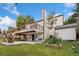 Backyard view showcases a two-story deck, patio, storage shed, and garden area at 3390 S Ensenada Way, Aurora, CO 80013