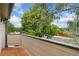 Balcony with wood-look tile flooring offers a place to relax and enjoy the views of the surrounding neighborhood at 3390 S Ensenada Way, Aurora, CO 80013
