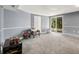 Basement with neutral colored walls, a sliding glass door, and plush carpet at 3390 S Ensenada Way, Aurora, CO 80013