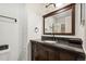 Modern bath with dark cabinets, granite countertop and modern fixtures at 3390 S Ensenada Way, Aurora, CO 80013