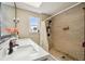 Bathroom with a large, tiled shower and dual sinks with modern fixtures, offering style and convenience at 3390 S Ensenada Way, Aurora, CO 80013