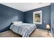 Comfortable bedroom with blue walls, a window, and plush carpeting at 3390 S Ensenada Way, Aurora, CO 80013