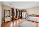 Bright bedroom with wood floors, ample natural light from large windows and a decorative wardrobe at 3390 S Ensenada Way, Aurora, CO 80013