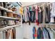 Walk-in closet with organized shelves, rods, and ample hanging space for clothes and accessories at 3390 S Ensenada Way, Aurora, CO 80013