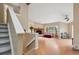 Bright living room with hardwood floors, fireplace, and a large window for natural light at 3390 S Ensenada Way, Aurora, CO 80013