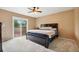 Bedroom with a slider to an outdoor deck offering an ideal space for relaxation and enjoying fresh air at 3390 S Ensenada Way, Aurora, CO 80013
